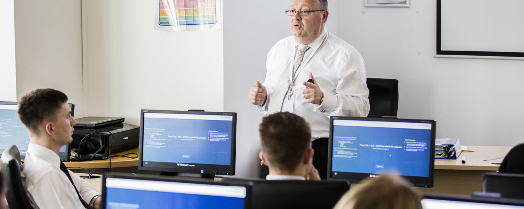 Apprentices in classroom with trainer